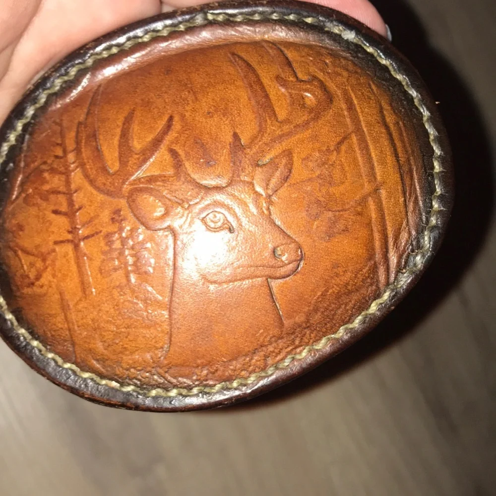 - Handcrafted leather seat belt buckle in brown